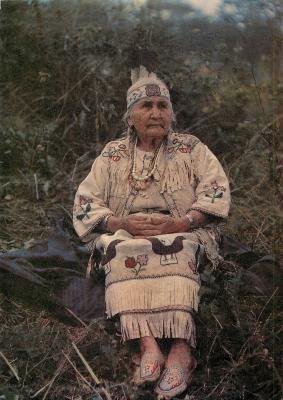 [Woman in regalia from the interior]
